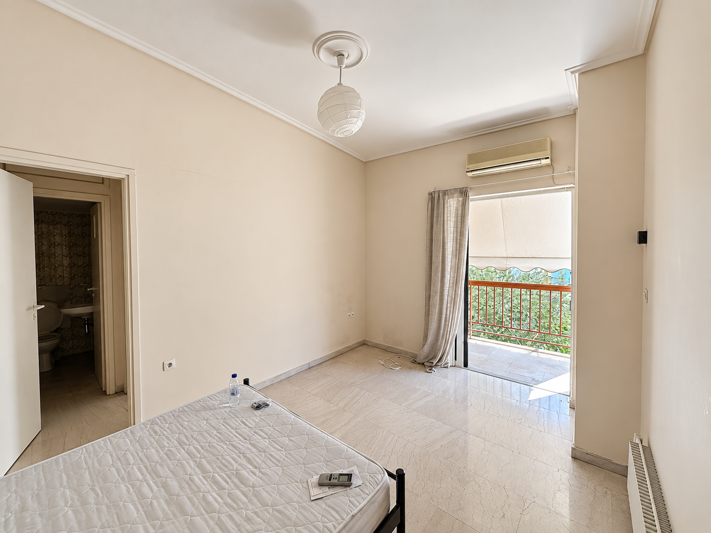 Bright one-bedroom apartment interior with balcony at Damareos 131, Pagrati, Athens